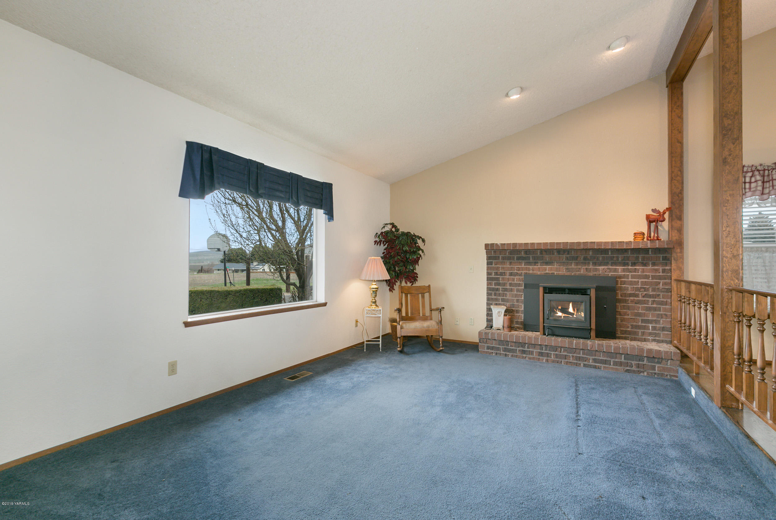 61 Faucher Road Yakima, WA 98901 - Photo 5 of 27 a view of a livingroom with a fireplace and window