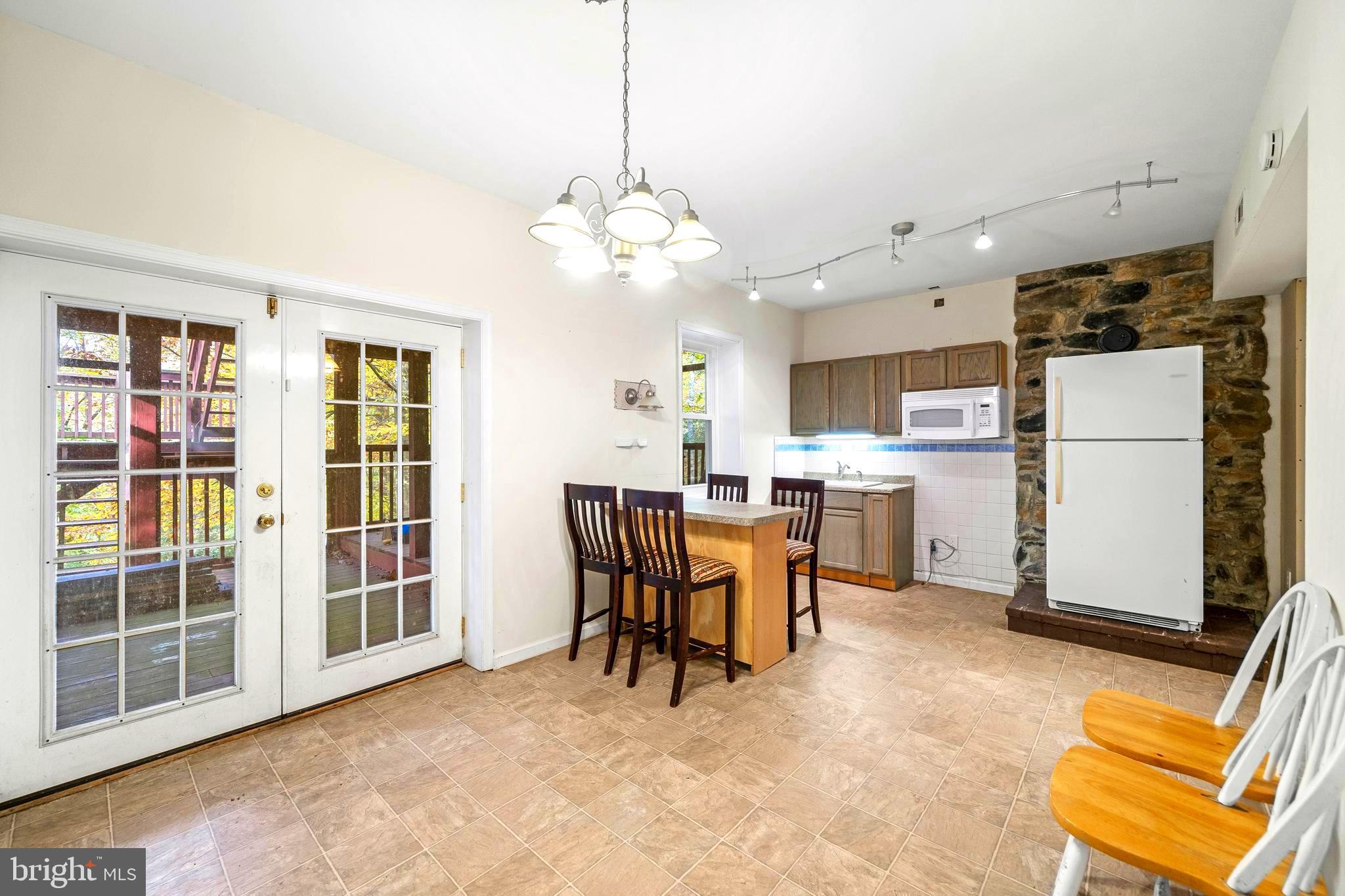 631 San Gabriel Road Lusby, MD 20657 - Photo 27 of 31 Lower Level kitchen with access to lower porch.