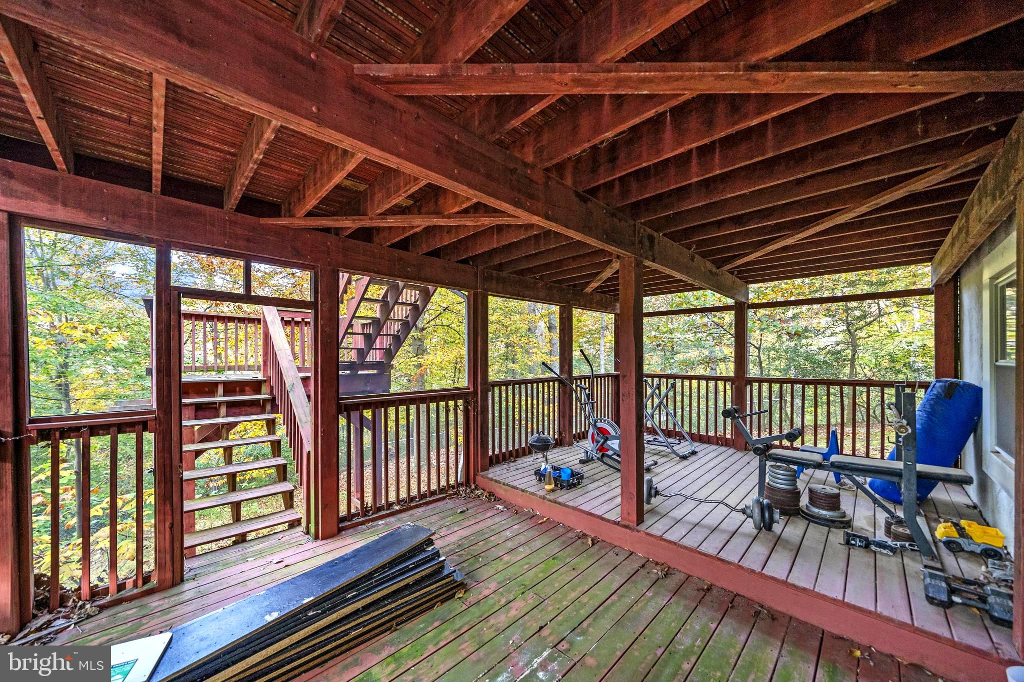 631 San Gabriel Road Lusby, MD 20657 - Photo 6 of 31 Lower screened porch off the apartment.