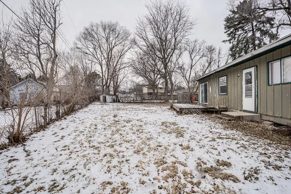a backyard of a house with large trees