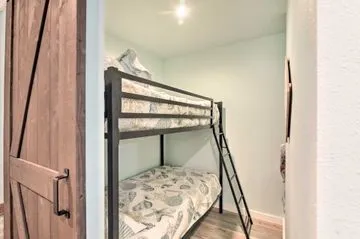 a view of bedroom with a bed and stairs