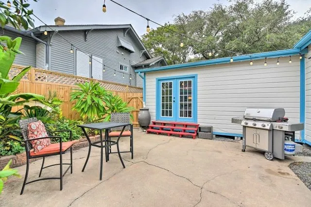 a backyard of a house with yard and furniture