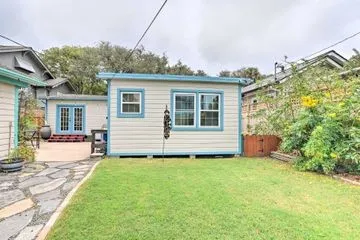 a view of a house with a yard and sitting area