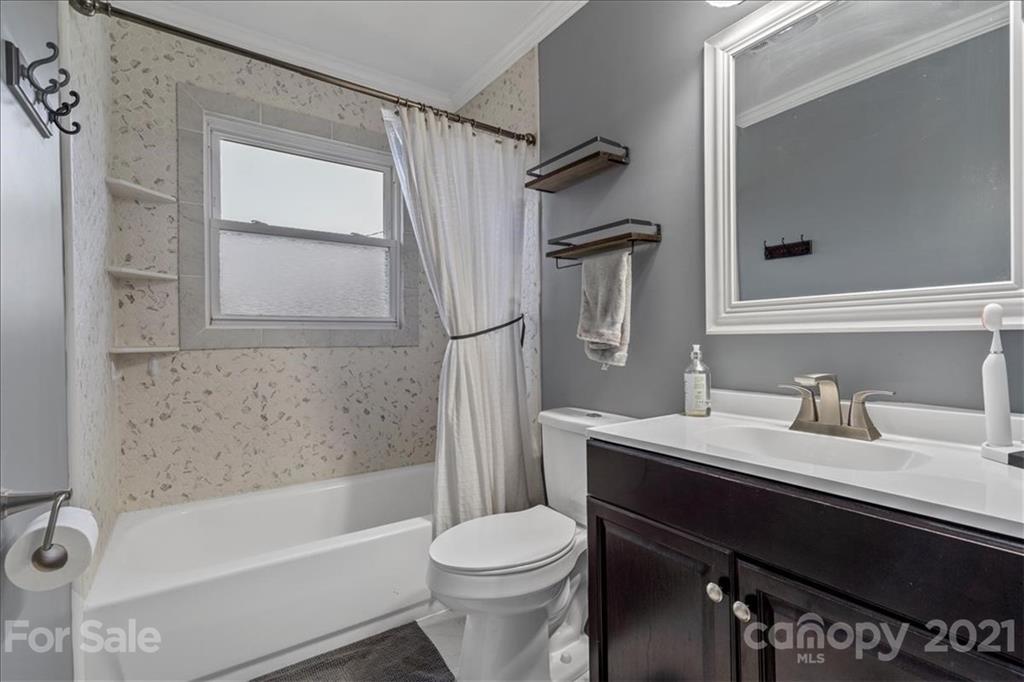 4620 Needmore Road Woodleaf, NC 27054 - Photo 14 of 27 a bathroom with a sink toilet and shower