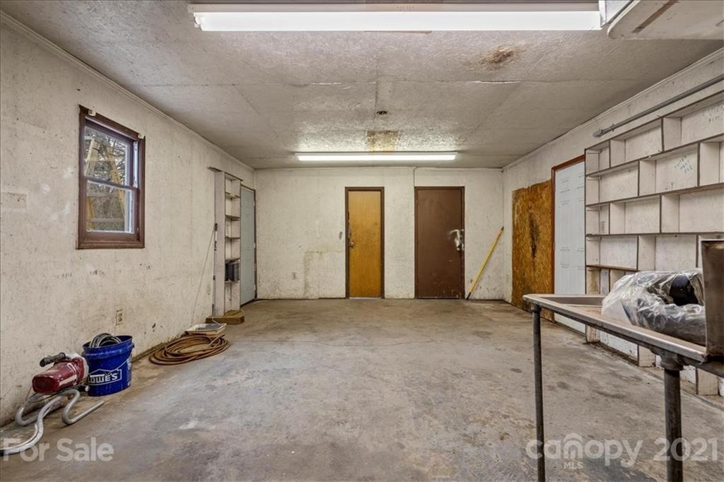 4620 Needmore Road Woodleaf, NC 27054 - Photo 22 of 27 a view of a livingroom with furniture and staircase