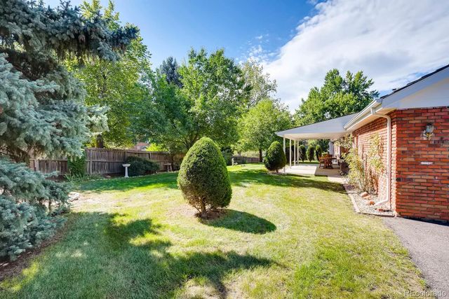 a view of a small house in the back yard