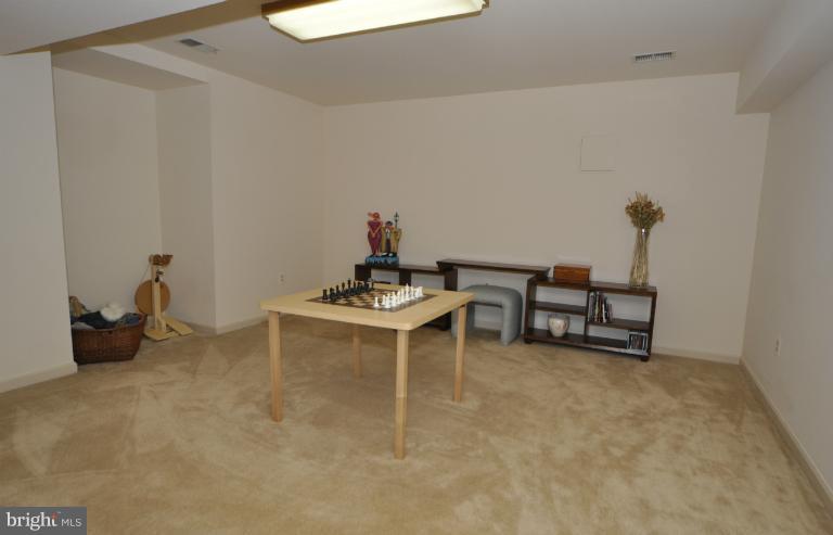 406 Ridge Road Southwest Vienna, VA 22180 - Photo 21 of 28 a view of a workspace with furniture