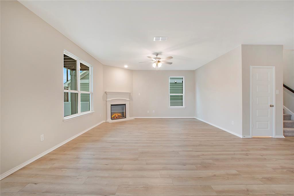 1605 Katharina Avenue Providence Village, TX 76227 - Photo 11 of 35 a view of an empty room with window and wooden floor