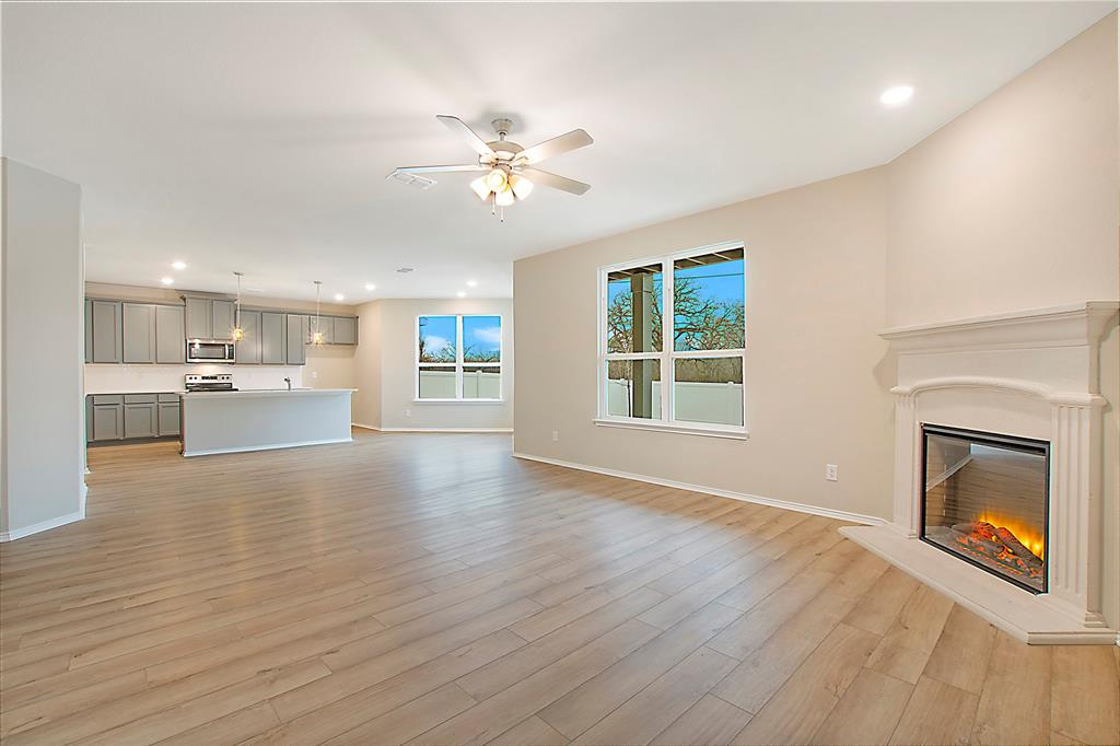 1605 Katharina Avenue Providence Village, TX 76227 - Photo 12 of 35 a view of an empty room with a fireplace and a window