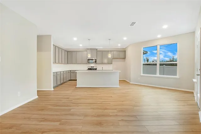 a view of kitchen with wooden floor