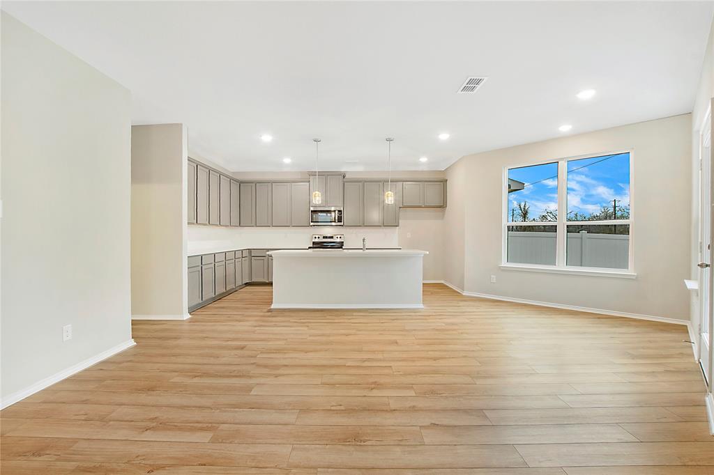 1605 Katharina Avenue Providence Village, TX 76227 - Photo 13 of 35 a view of kitchen with wooden floor