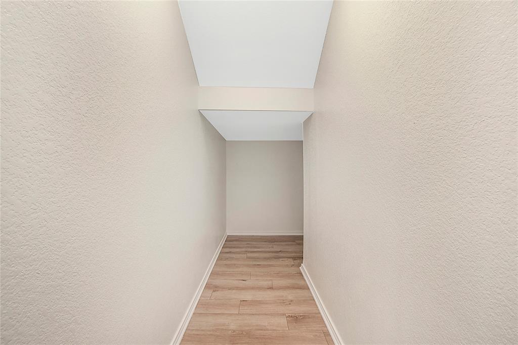 1605 Katharina Avenue Providence Village, TX 76227 - Photo 20 of 35 a view of a hallway with wooden floor