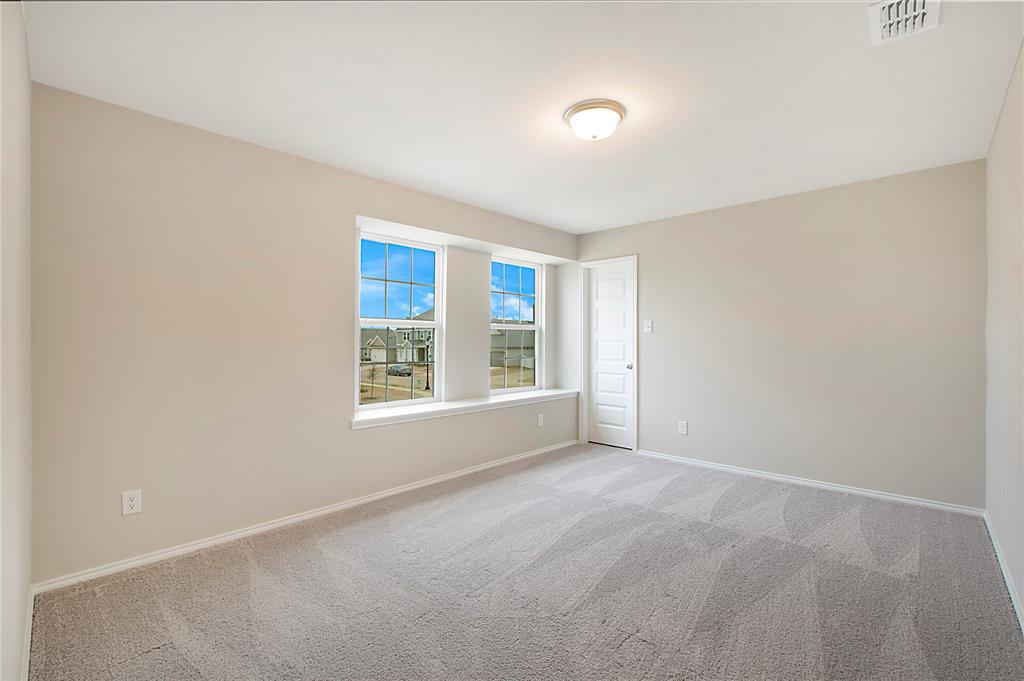 1605 Katharina Avenue Providence Village, TX 76227 - Photo 31 of 35 a view of an empty room with a window