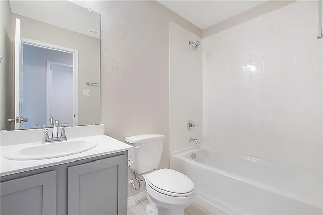 a bathroom with a toilet a sink and a bathtub