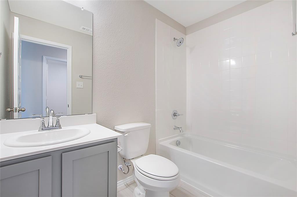 1605 Katharina Avenue Providence Village, TX 76227 - Photo 35 of 35 a bathroom with a toilet a sink and a bathtub