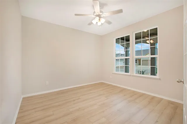 a view of an empty room with a window