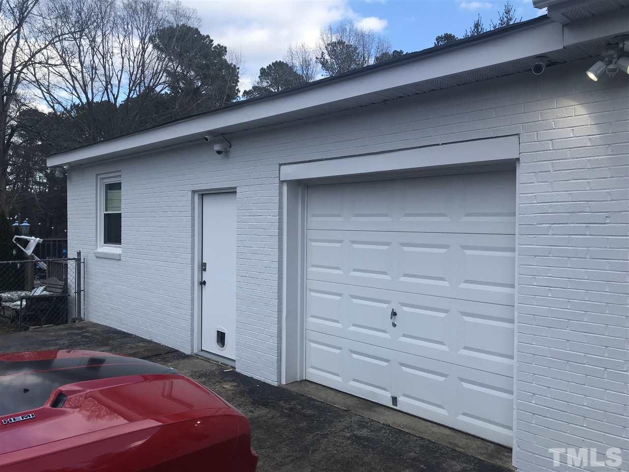 3814 Cole Mill Road Durham, NC 27712 - Photo 24 of 28 One car garage space and guest room with full bath off of the attached portion of the main house.