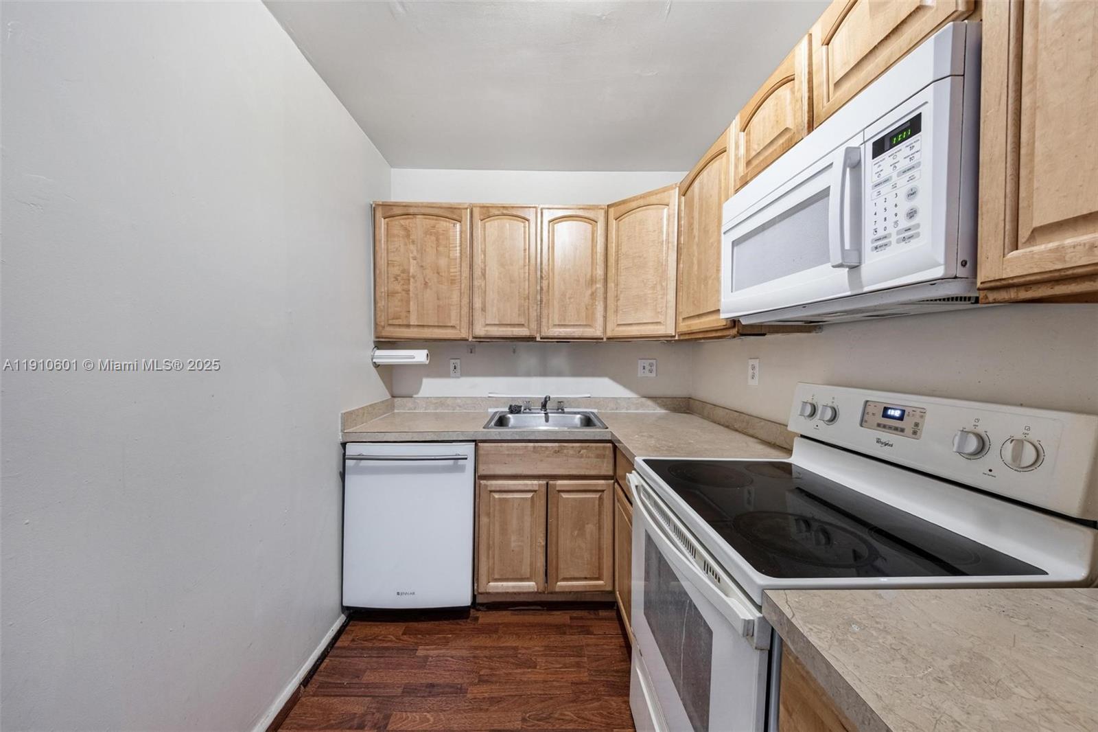 405 South Pine Island Road, Unit 405D Plantation, FL 33324 - Photo 11 of 28 a kitchen with stainless steel appliances granite countertop a sink and a stove