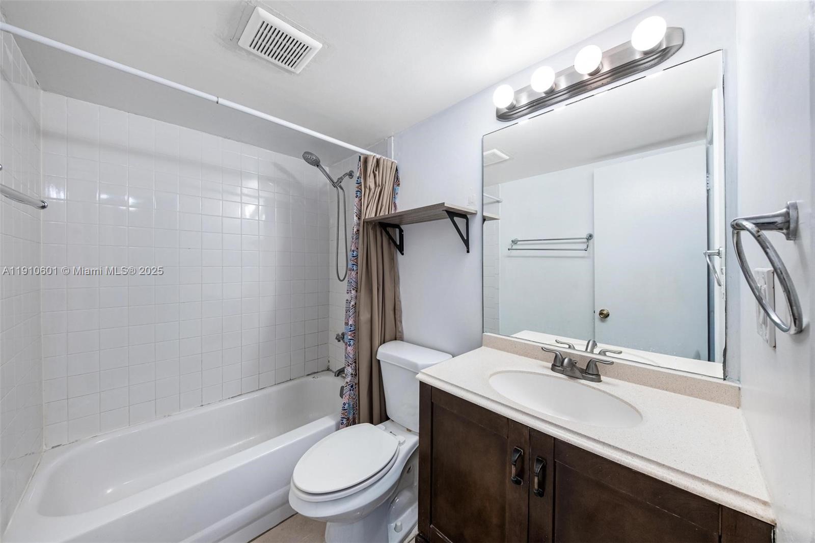 405 South Pine Island Road, Unit 405D Plantation, FL 33324 - Photo 14 of 28 a bathroom with a sink a toilet and shower