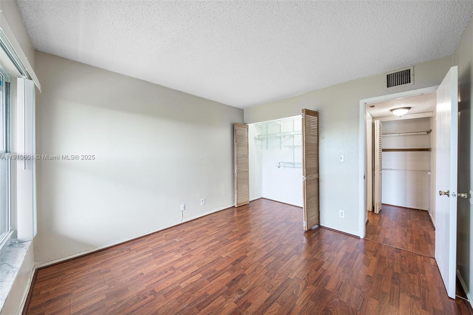 405 South Pine Island Road, Unit 405D Plantation, FL 33324 - Photo 15 of 28 a view of empty room with wooden floor