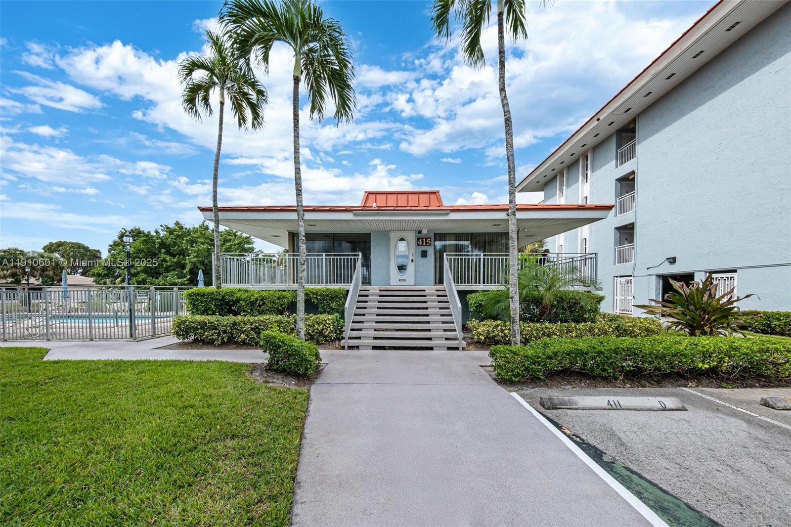 405 South Pine Island Road, Unit 405D Plantation, FL 33324 - Photo 21 of 28 a front view of a house with garden