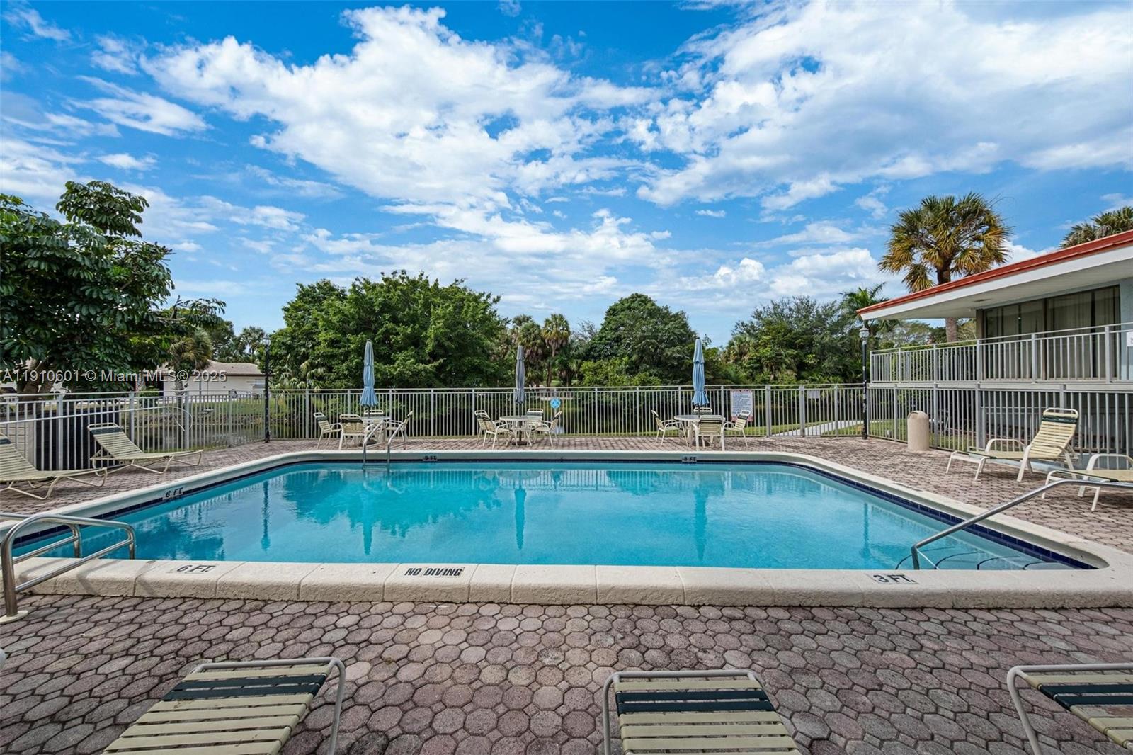 405 South Pine Island Road, Unit 405D Plantation, FL 33324 - Photo 23 of 28 a view of a swimming pool with a lounge chair