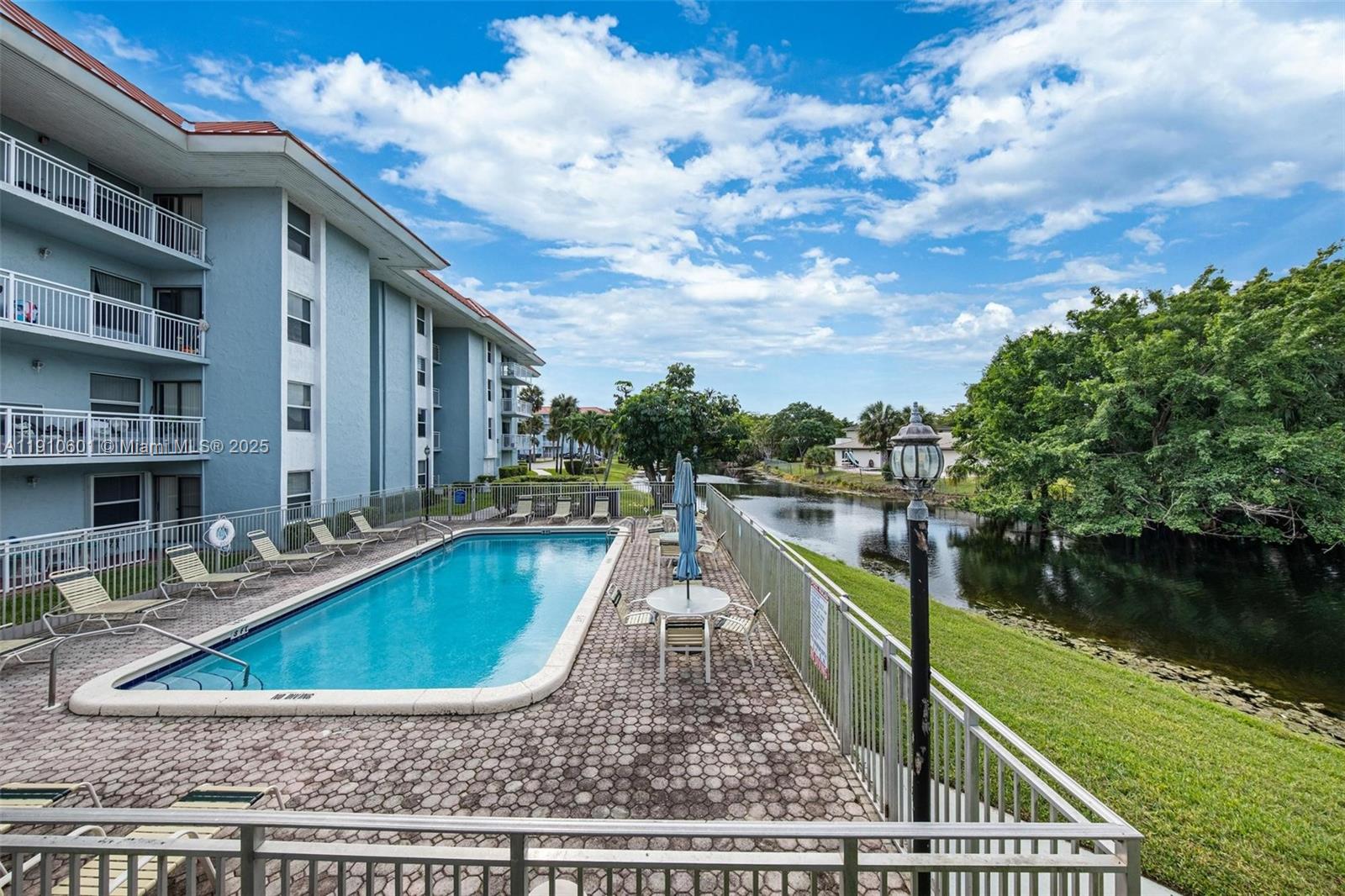 405 South Pine Island Road, Unit 405D Plantation, FL 33324 - Photo 27 of 28 a view of a lake with a terrace