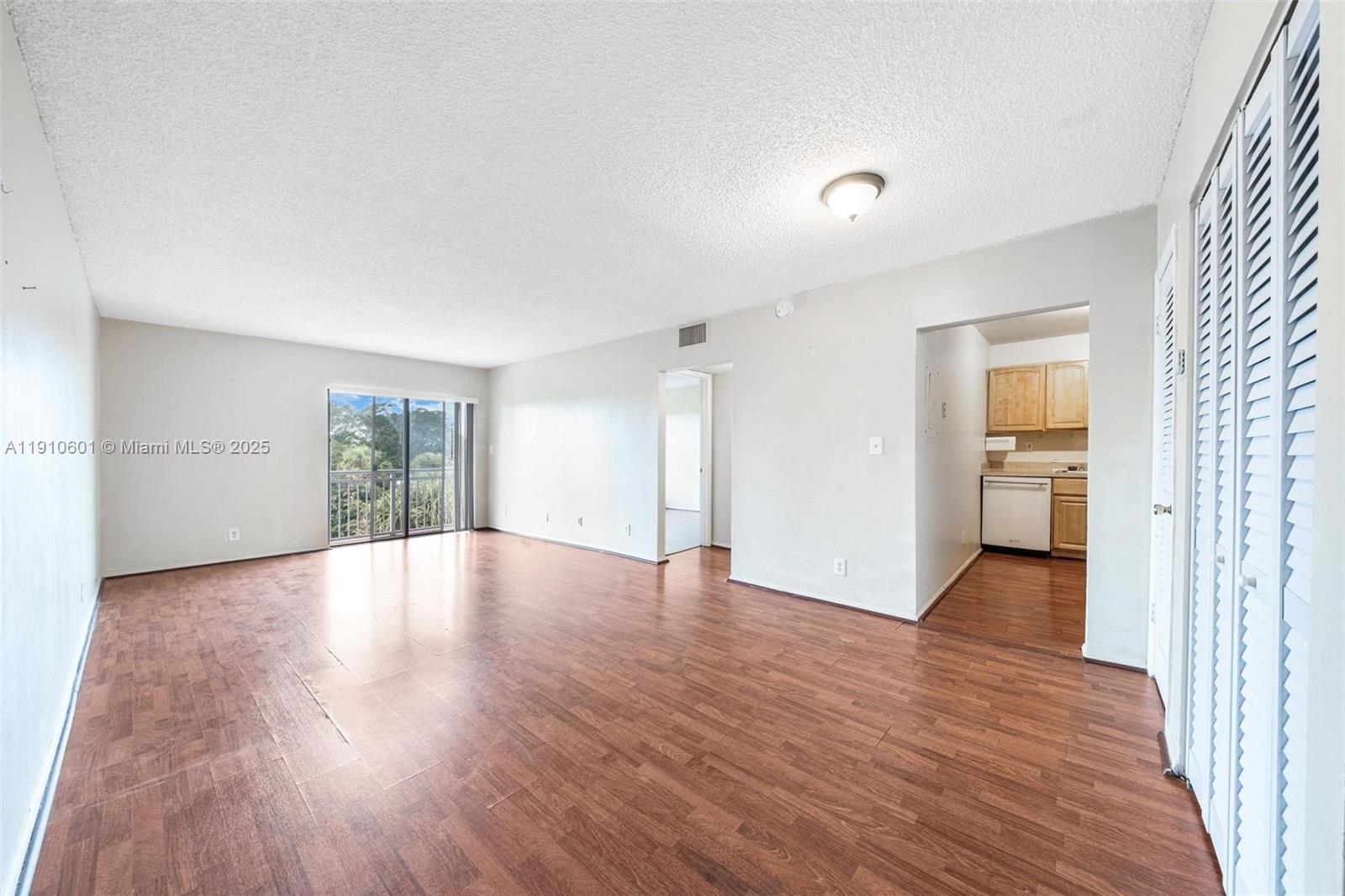 405 South Pine Island Road, Unit 405D Plantation, FL 33324 - Photo 5 of 28 a view of wooden floor and windows in an empty room