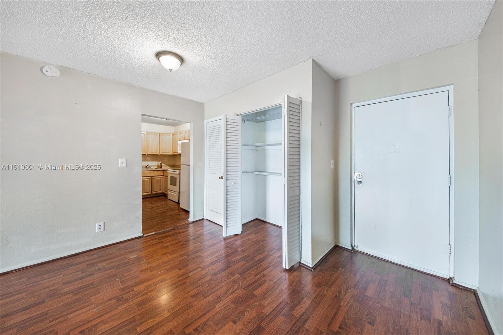 405 South Pine Island Road, Unit 405D Plantation, FL 33324 - Photo 9 of 28 wooden floor in an empty room