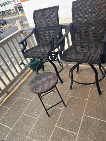 a view of balcony with furniture