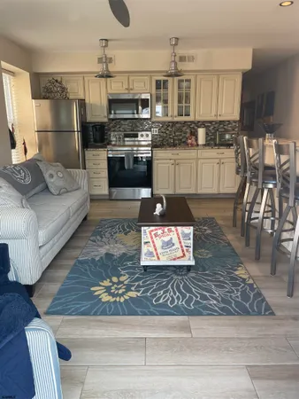 a living room with couches and a flat screen tv