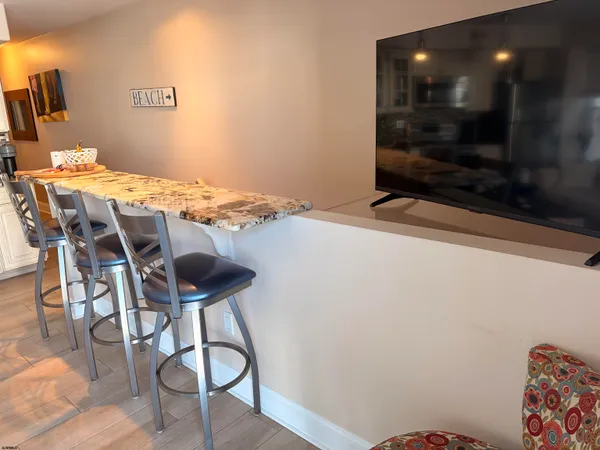 a swimming pool with outdoor seating