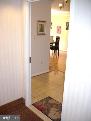1808 Old Meadow Road, Unit 1405 McLean, VA 22102 - Photo 3 of 30 a view of a dining room with furniture