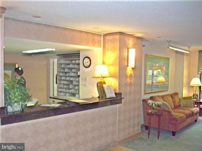 1808 Old Meadow Road, Unit 1405 McLean, VA 22102 - Photo 26 of 30 a living room with furniture and a window
