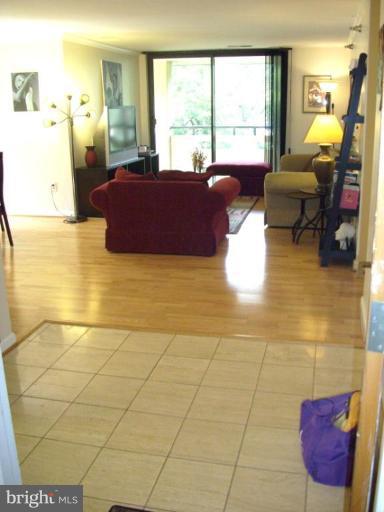 1808 Old Meadow Road, Unit 1405 McLean, VA 22102 - Photo 27 of 30 a living room with furniture and a large window