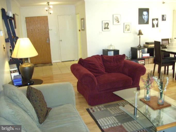1808 Old Meadow Road, Unit 1405 McLean, VA 22102 - Photo 5 of 30 a living room with furniture and a window