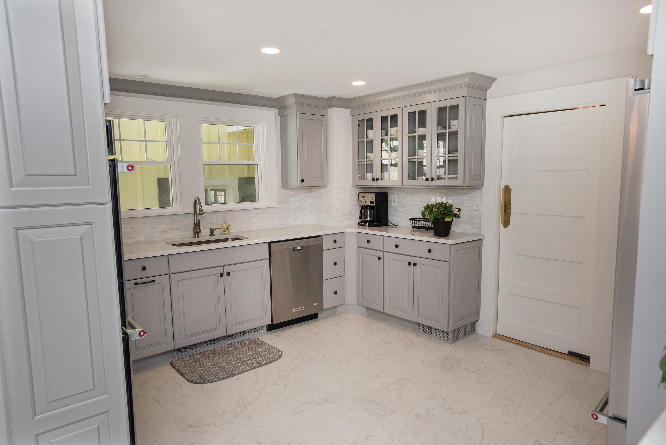 43 Marvin Ridge Road New Canaan, CT 06840 - Photo 14 of 41 a kitchen with white cabinets and sink