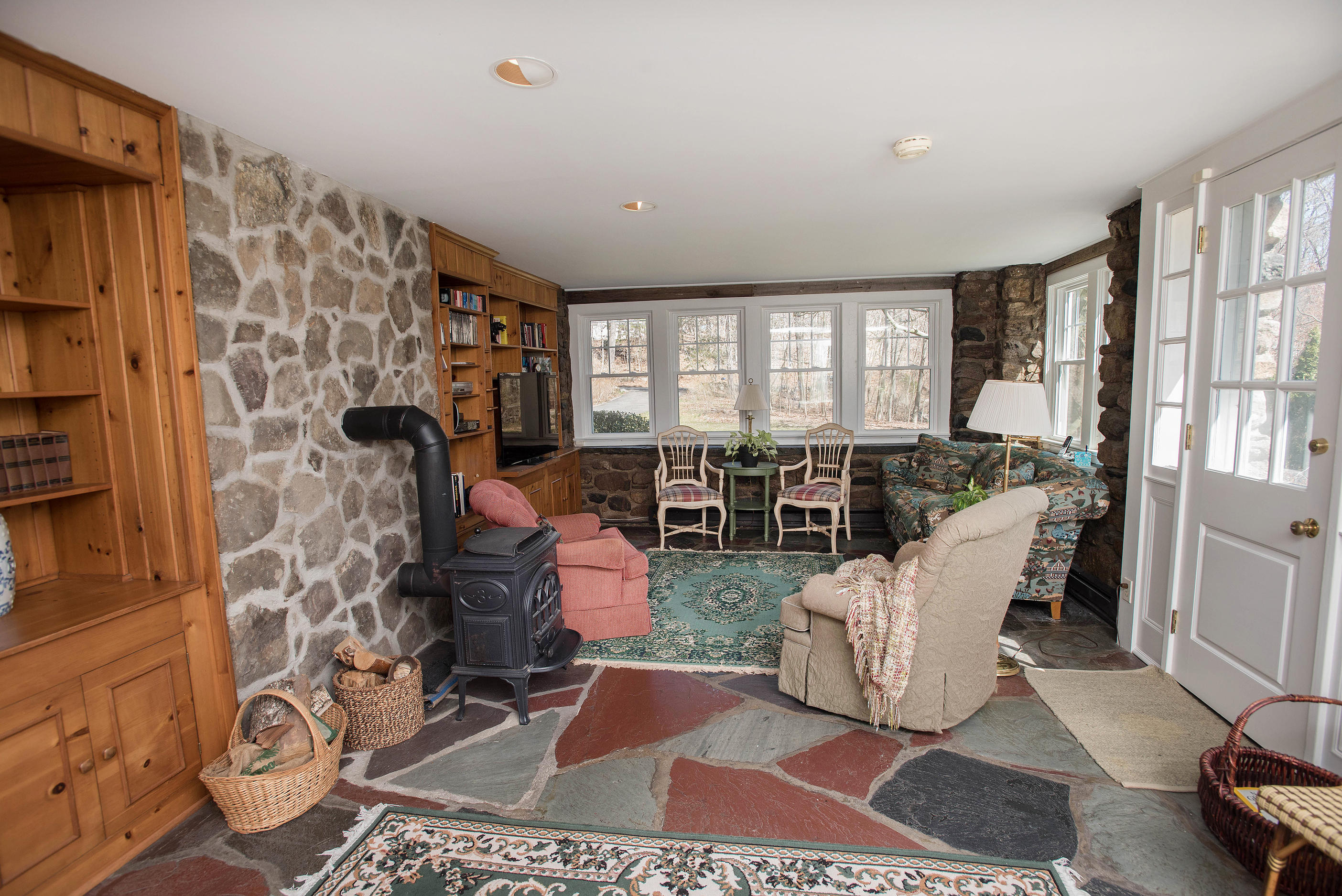 43 Marvin Ridge Road New Canaan, CT 06840 - Photo 19 of 41 a living room with furniture and a floor to ceiling window
