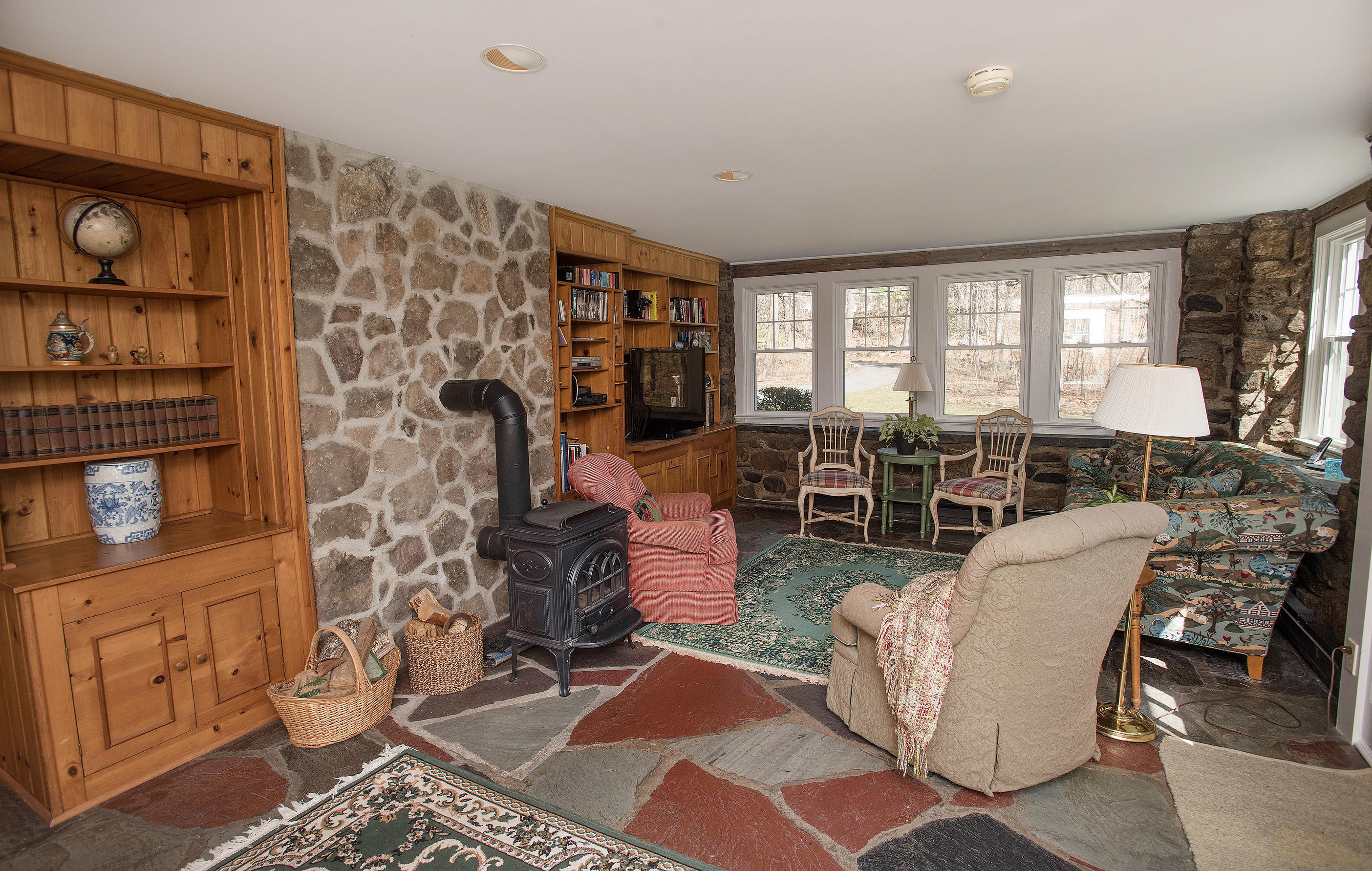43 Marvin Ridge Road New Canaan, CT 06840 - Photo 20 of 41 a living room with fireplace furniture and a window