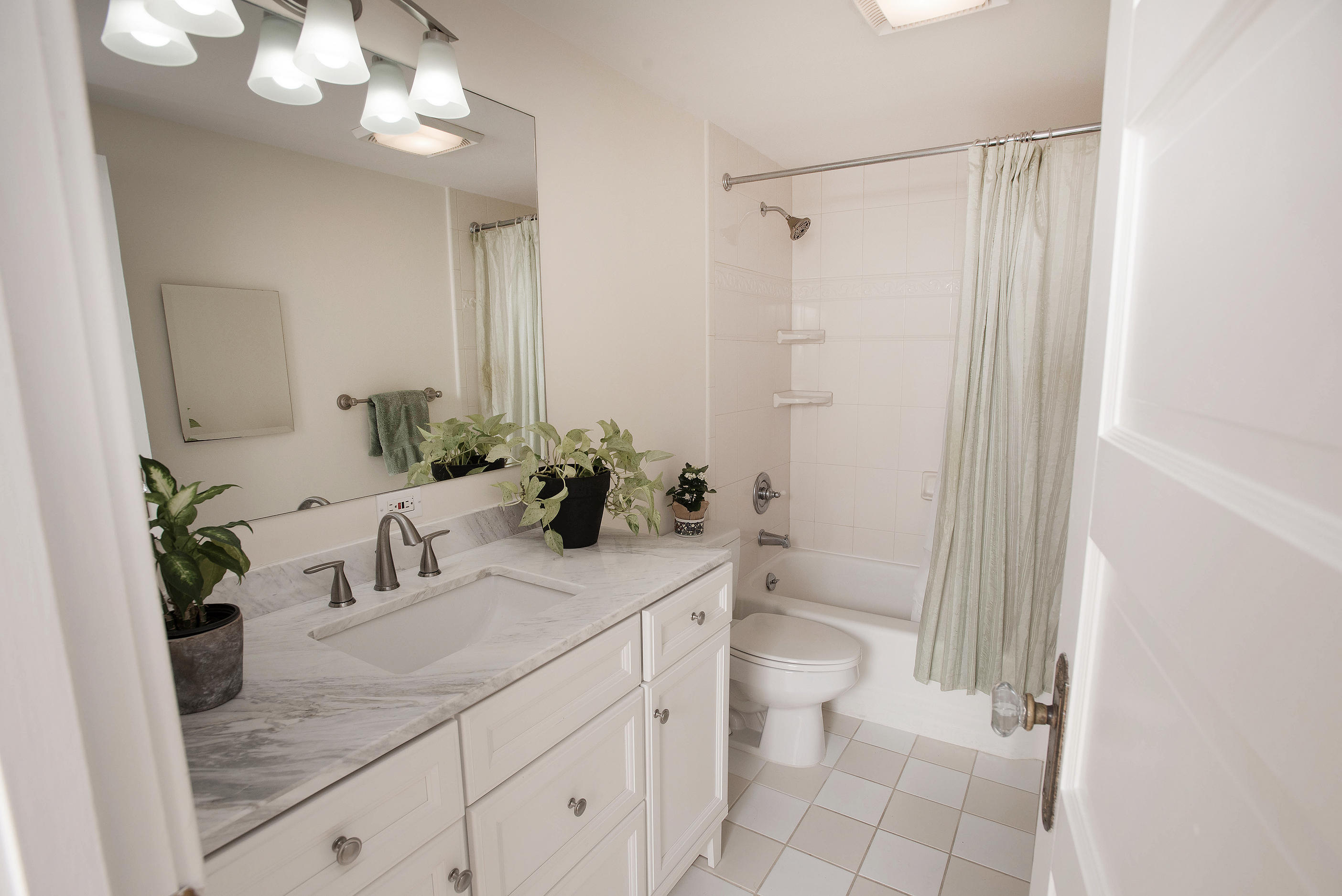43 Marvin Ridge Road New Canaan, CT 06840 - Photo 27 of 41 a bathroom with a sink a toilet and a mirror