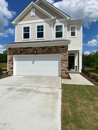 a front view of a house with yard