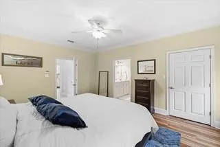 a bathroom with a shower sink vanity and mirror