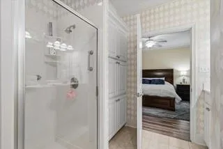 a kitchen with granite countertop white cabinets sink and white appliances