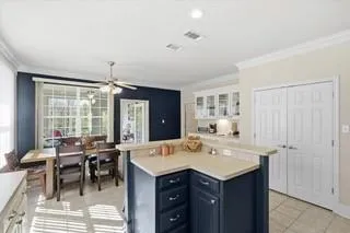 a view of a dining room with furniture and windows