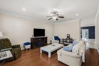 a living room with furniture and a flat screen tv