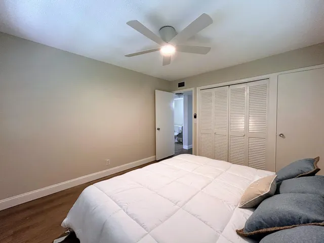 a bathroom with a toilet a sink and a mirror