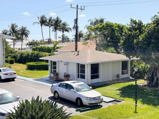a view of a livingroom with furniture and a window