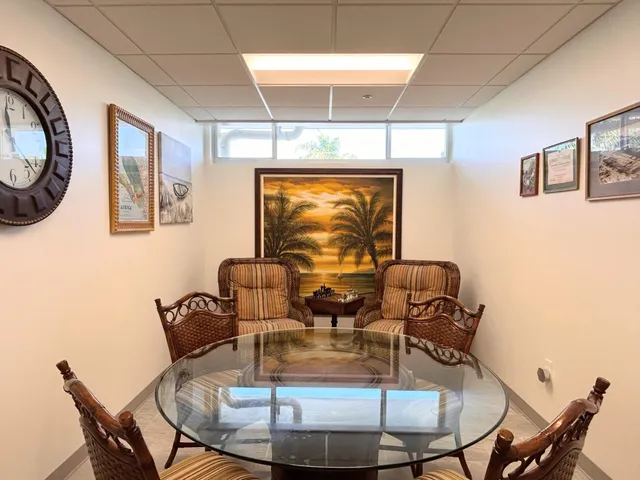a view of a dining area with furniture and chandelier