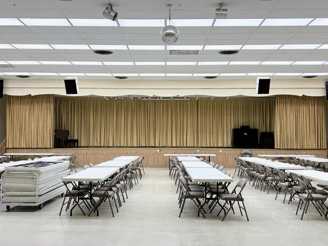 a view of a dining room with furniture large windows and wooden floor