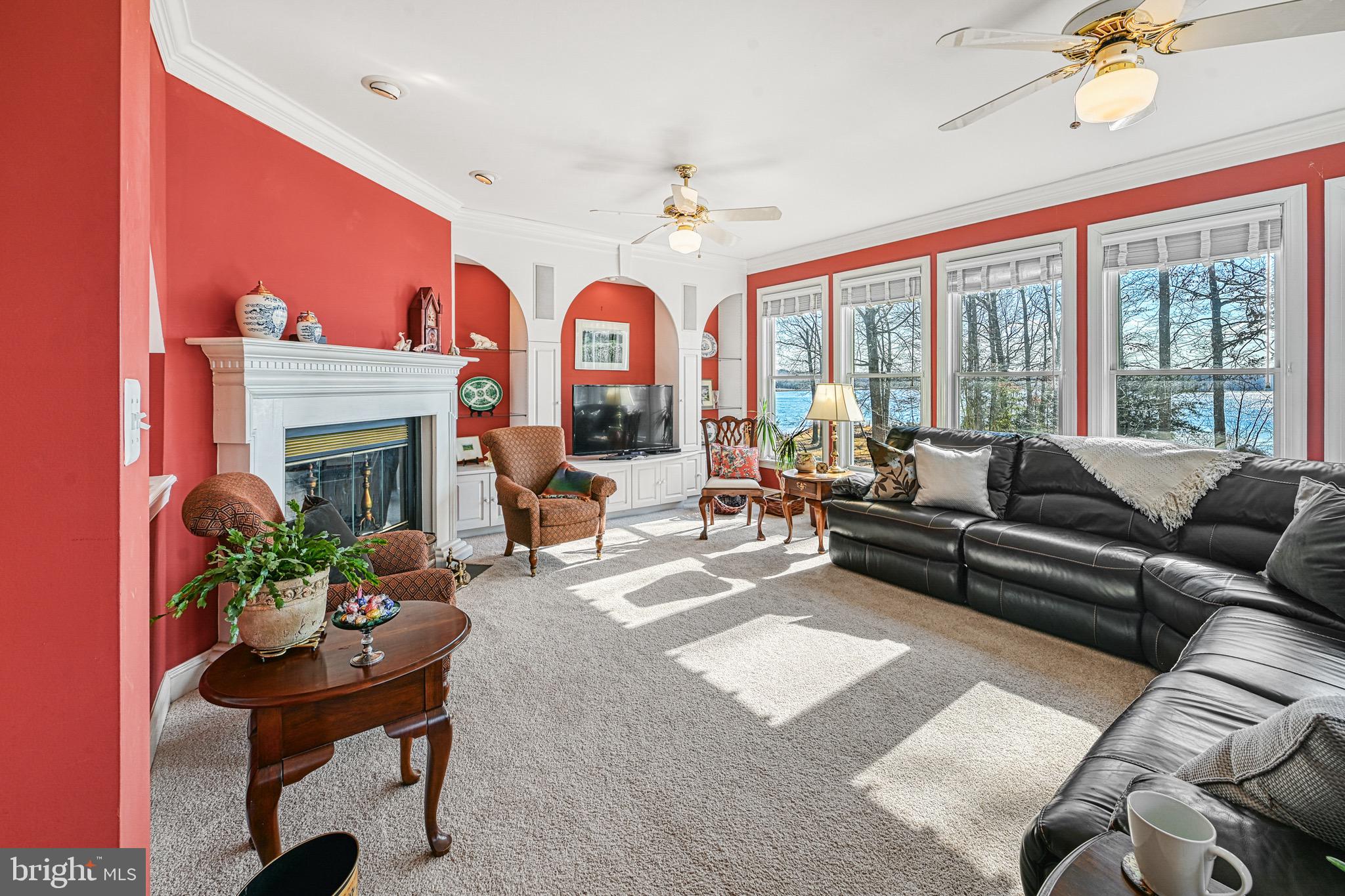 175 Covenant Way Bumpass, VA 23024 - Photo 115 of 140 a living room with furniture a chandelier and a fireplace